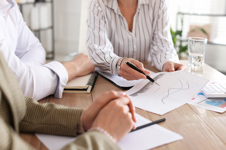 Couple having a meeting about superannuation strategies for retirees with financial adviser
